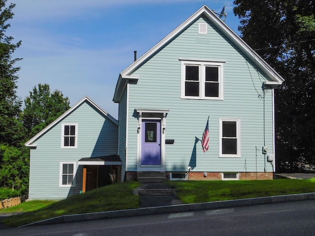 124 Church St, Dexter, ME 04930 - view of front of home with entry steps and a front yard