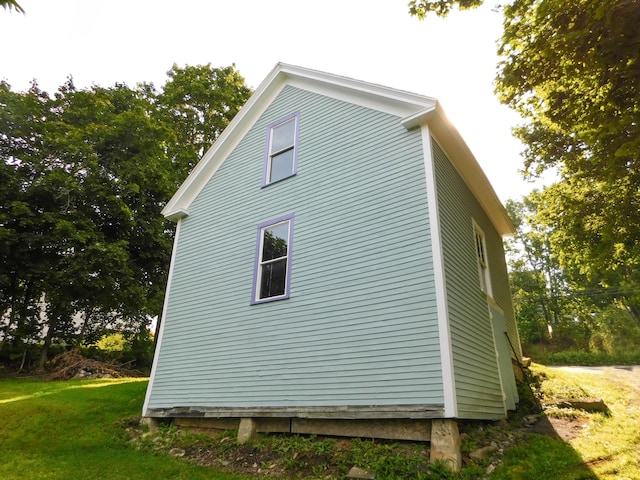 124 Church St, Dexter, ME 04930 - view of side of property with a lawn