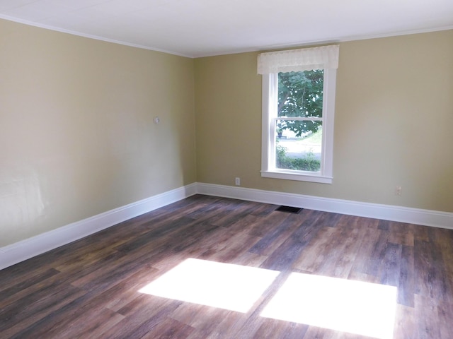 124 Church St, Dexter, ME 04930 - spare room featuring ornamental molding, baseboards, and dark wood-style floors