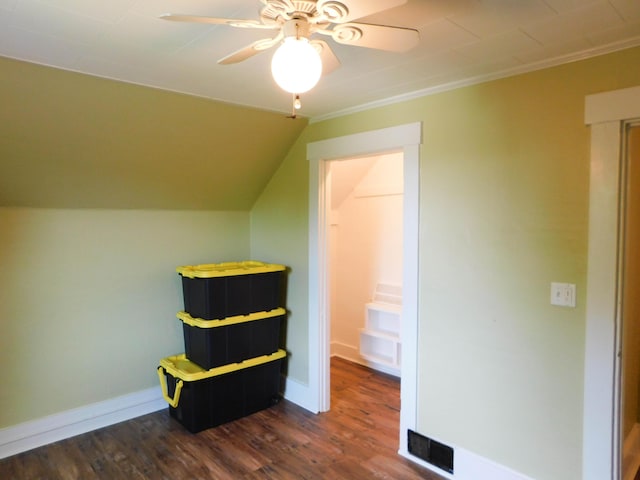 124 Church St, Dexter, ME 04930 - bedroom featuring dark wood-style flooring, crown molding, baseboards, ceiling fan, and lofted ceiling