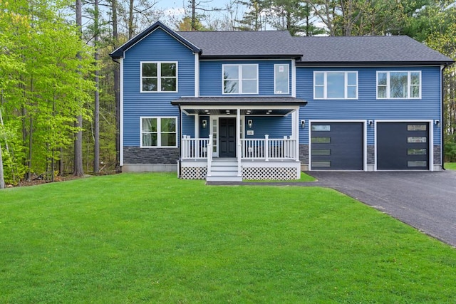 15 Stone Ledge Dr, Lewiston, ME 04240 - view of front of property featuring covered porch, an attached garage, asphalt driveway, a front yard, and stone siding