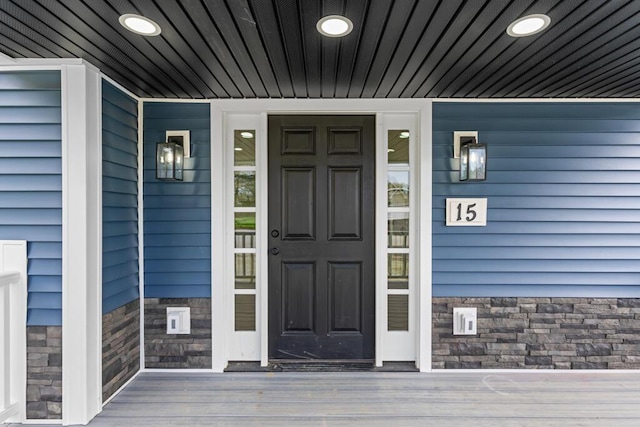 15 Stone Ledge Dr, Lewiston, ME 04240 - doorway to property with a porch and stone siding