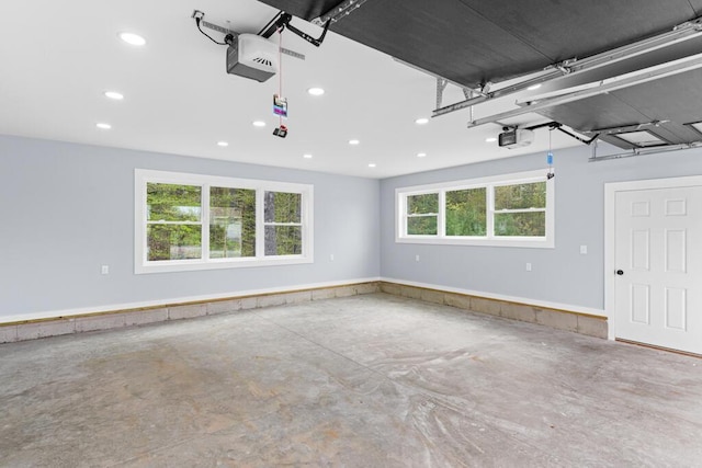 15 Stone Ledge Dr, Lewiston, ME 04240 - garage with recessed lighting and a garage door opener