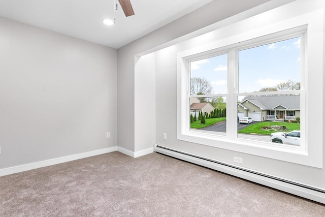 15 Stone Ledge Dr, Lewiston, ME 04240 - carpeted spare room with a baseboard radiator, a ceiling fan, and baseboards