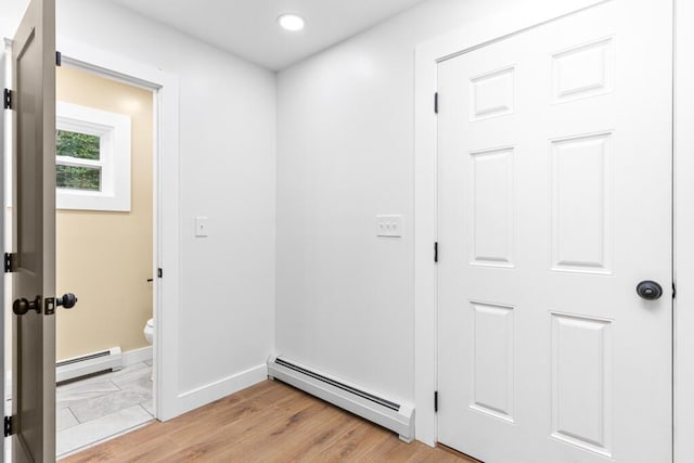 15 Stone Ledge Dr, Lewiston, ME 04240 - hall with a baseboard radiator, baseboards, recessed lighting, and light wood finished floors