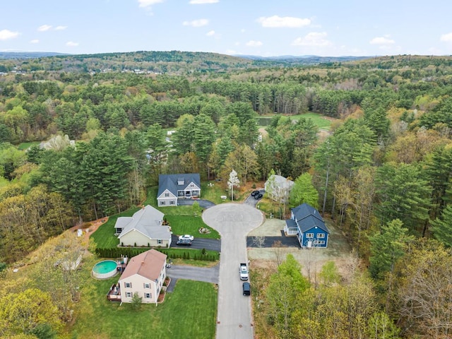 15 Stone Ledge Dr, Lewiston, ME 04240 - aerial view of property and surrounding area with a forest and a pool area