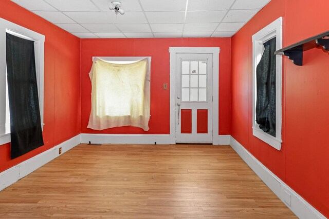 501 Knox St, Rumford, ME 04276 - foyer with wood finished floors, a paneled ceiling, and baseboards