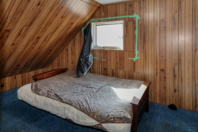 501 Knox St, Rumford, ME 04276 - carpeted bedroom featuring lofted ceiling and wooden walls
