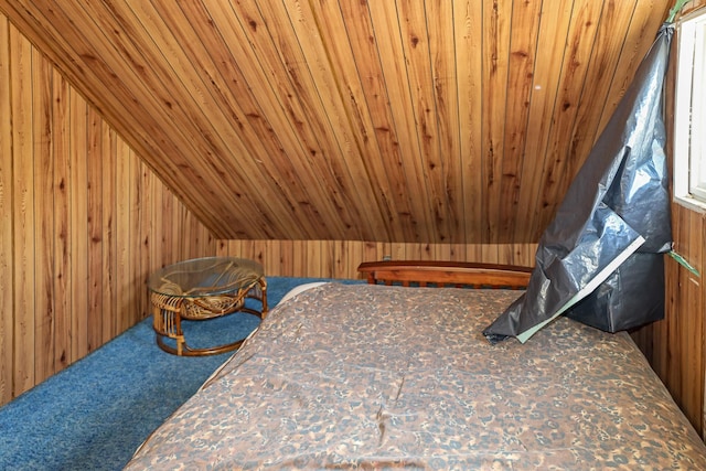 501 Knox St, Rumford, ME 04276 - carpeted bedroom with wood walls, wood ceiling, and vaulted ceiling