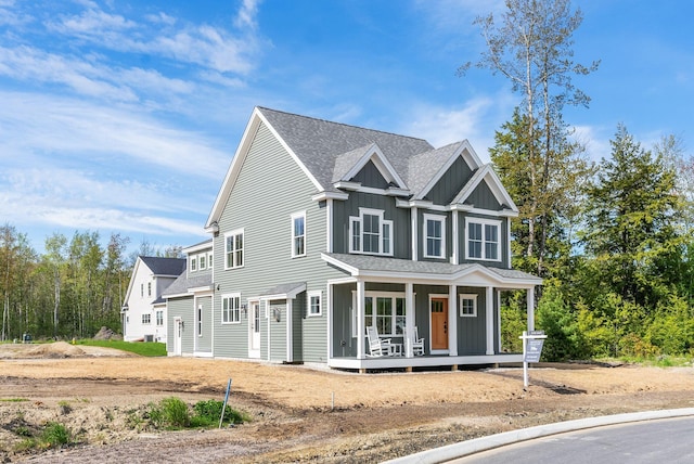 31 Emerson Way, Scarborough, ME 04074 - view of front of house featuring covered porch, board and batten siding, and a shingled roof