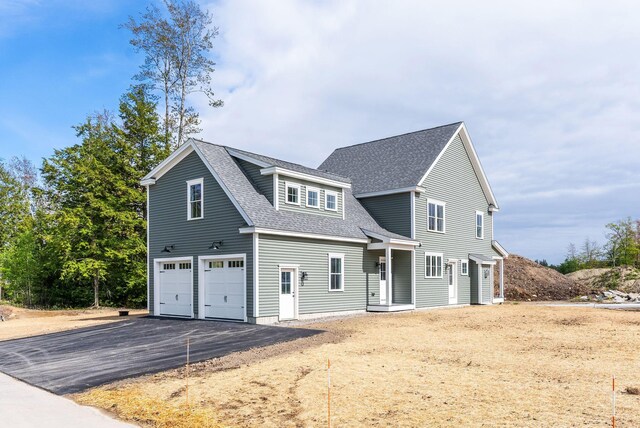 31 Emerson Way, Scarborough, ME 04074 - view of front of house featuring an attached garage, a shingled roof, and driveway