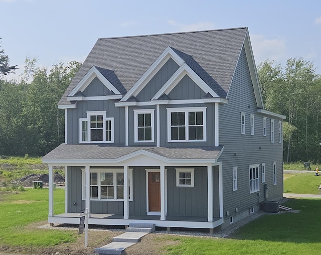 31 Emerson Way, Scarborough, ME 04074 - view of front of property with a shingled roof, a porch, a front yard, and board and batten siding