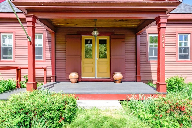 321 Clarks Bridge Rd, Waterboro, ME 04061 - doorway to property featuring a shingled roof, french doors, and a porch