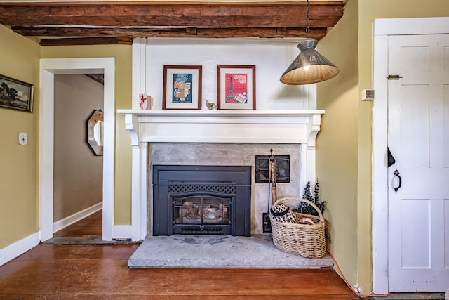 321 Clarks Bridge Rd, Waterboro, ME 04061 - detailed view of a glass covered fireplace, wood finished floors, and baseboards