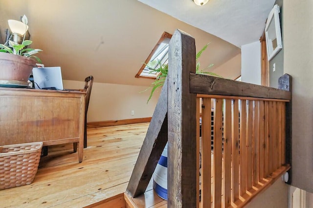 286 Canaan Rd, Clinton, ME 04927 - staircase featuring hardwood / wood-style flooring, vaulted ceiling, and baseboards