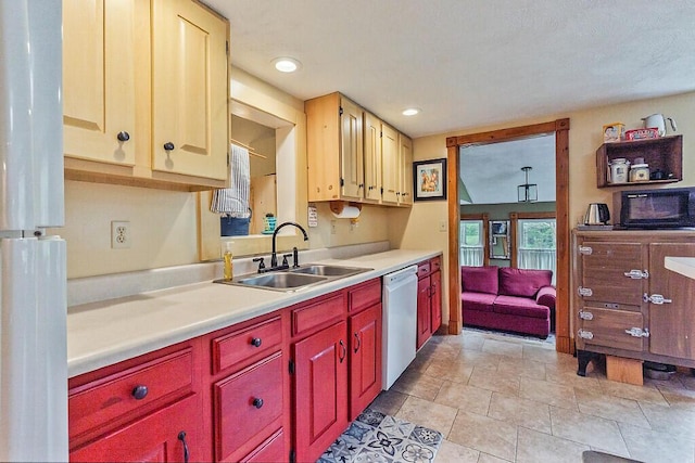 286 Canaan Rd, Clinton, ME 04927 - kitchen featuring white dishwasher, a sink, light countertops, recessed lighting, and light tile patterned floors