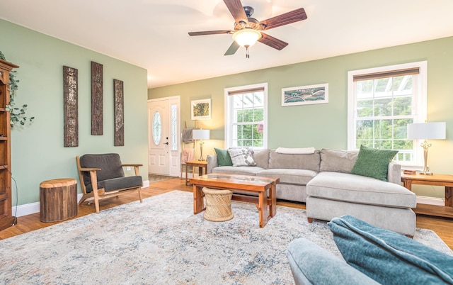 239 Cider Hill Rd, York, ME 03909 - living room with a ceiling fan, wood finished floors, and baseboards