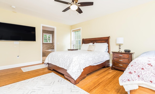 239 Cider Hill Rd, York, ME 03909 - bedroom featuring light wood-style flooring, baseboards, ensuite bathroom, and a ceiling fan
