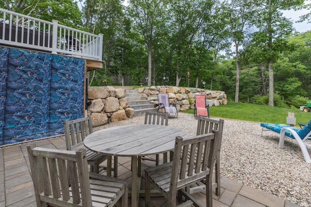 239 Cider Hill Rd, York, ME 03909 - view of patio featuring outdoor dining area and view of wooded area