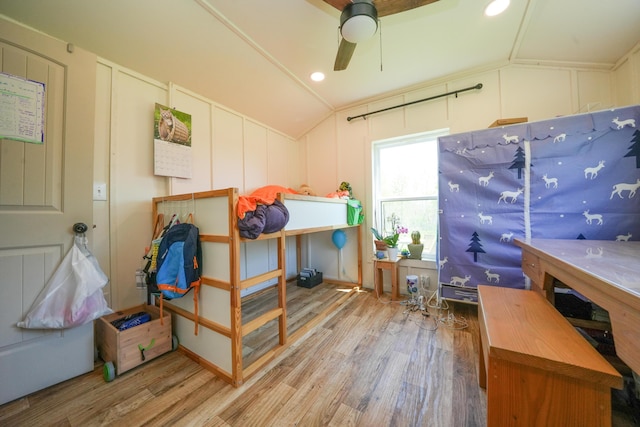 486 Main St, Orono, ME 04473 - bedroom featuring a decorative wall, wood finished floors, vaulted ceiling, a ceiling fan, and recessed lighting