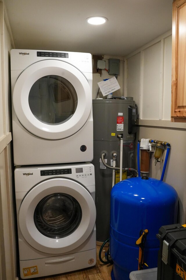 486 Main St, Orono, ME 04473 - laundry area featuring stacked washer / drying machine, cabinet space, and recessed lighting