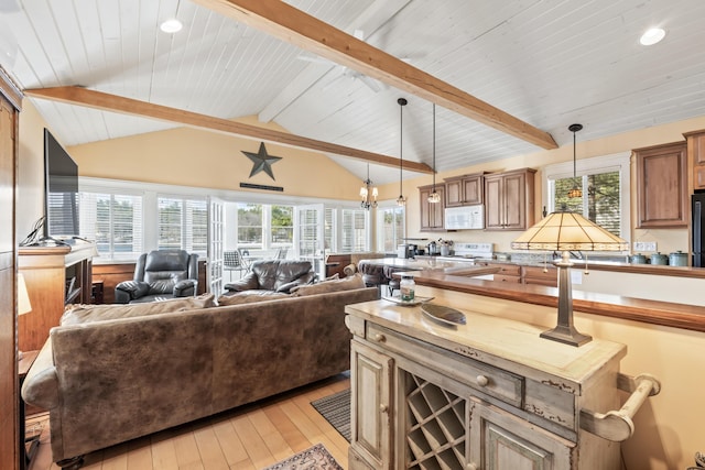 159 Loop Rd, Acton, ME 04001 - kitchen with white appliances, open floor plan, light wood-style floors, wooden ceiling, and pendant lighting