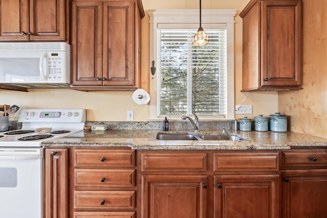 159 Loop Rd, Acton, ME 04001 - kitchen with white appliances, a sink, brown cabinetry, decorative light fixtures, and light stone countertops