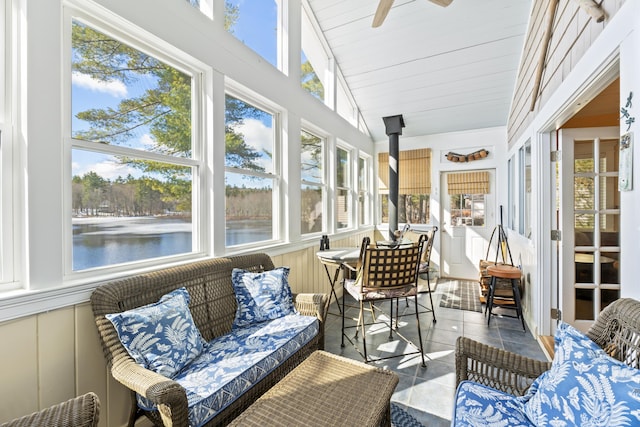 159 Loop Rd, Acton, ME 04001 - sunroom featuring healthy amount of natural light, tile patterned flooring, a water view, and a decorative wall