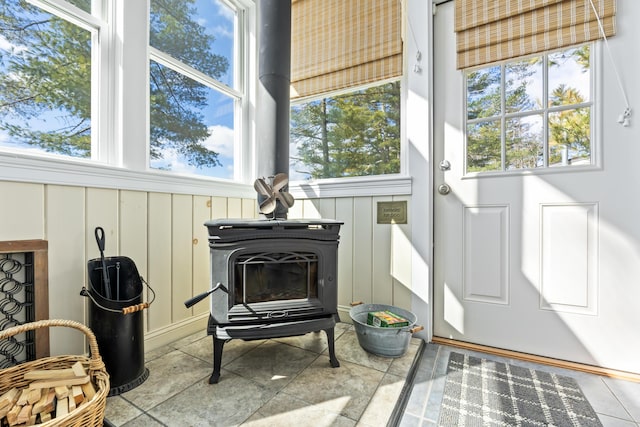 159 Loop Rd, Acton, ME 04001 - sunroom / solarium featuring a wood stove