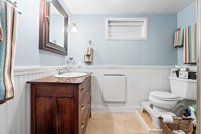 159 Loop Rd, Acton, ME 04001 - bathroom featuring toilet, wainscoting, vanity, and tile patterned floors