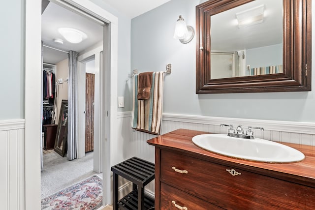 159 Loop Rd, Acton, ME 04001 - full bathroom featuring wainscoting and vanity