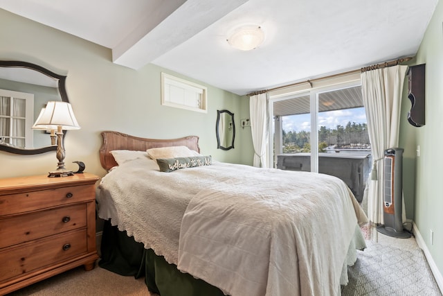 159 Loop Rd, Acton, ME 04001 - bedroom featuring carpet floors, access to exterior, baseboards, and beamed ceiling