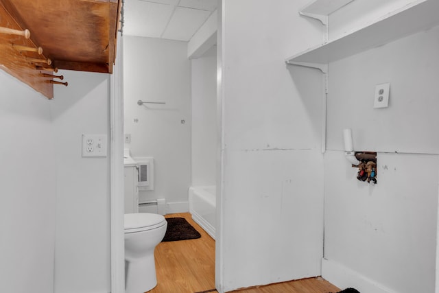 138 Summer St, Biddeford, ME 04005 - full bath with toilet, a bathtub, wood finished floors, a baseboard radiator, and a shower