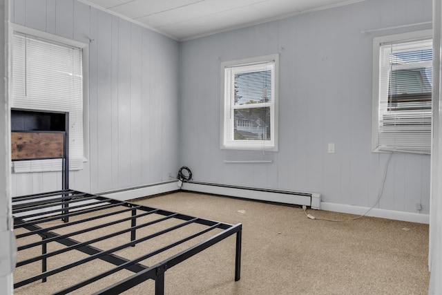 138 Summer St, Biddeford, ME 04005 - carpeted spare room with crown molding, healthy amount of natural light, and a baseboard heating unit