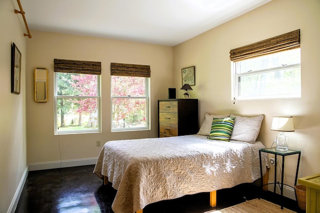 1496 Atlantic Hwy, Northport, ME 04849 - bedroom with baseboards, multiple windows, and concrete floors