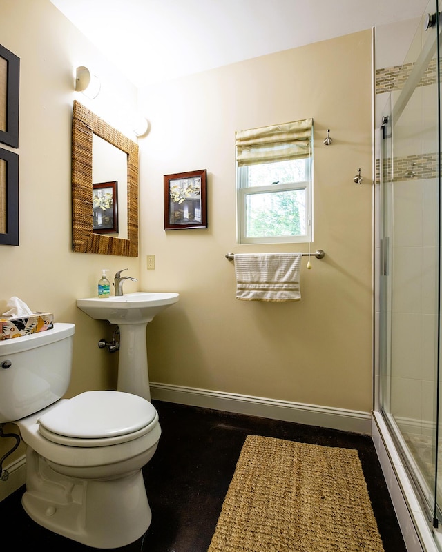 1496 Atlantic Hwy, Northport, ME 04849 - bathroom featuring toilet, a stall shower, and baseboards