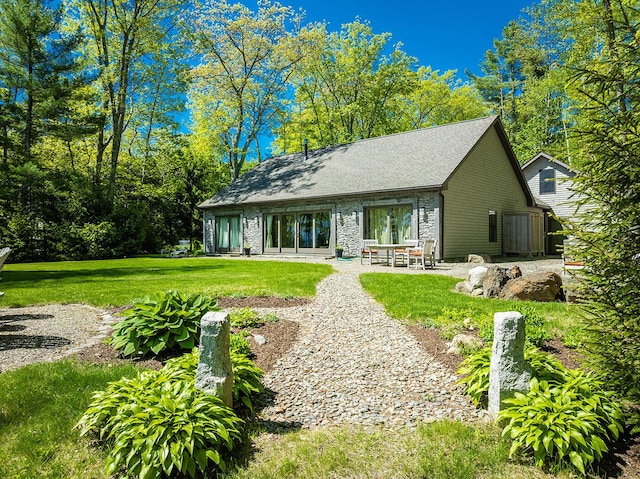 1496 Atlantic Hwy, Northport, ME 04849 - back of property featuring a yard, stone siding, and a patio area