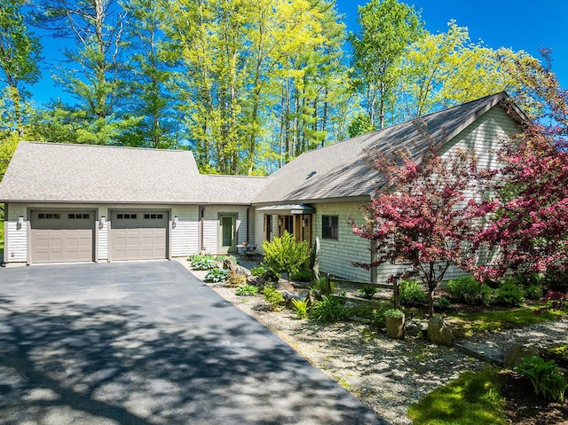 1496 Atlantic Hwy, Northport, ME 04849 - view of front of property with an attached garage, asphalt driveway, and a shingled roof