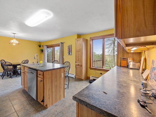 19 Falls Rd, Benton, ME 04901 - kitchen with stainless steel dishwasher, dark countertops, a baseboard radiator, a sink, and a kitchen breakfast bar