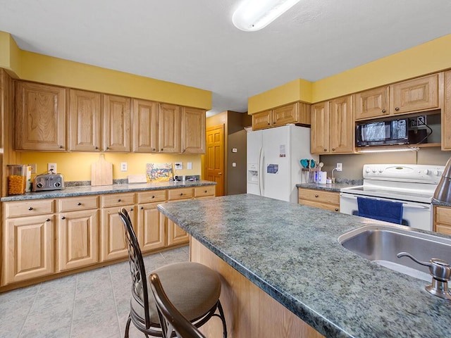 19 Falls Rd, Benton, ME 04901 - kitchen featuring white appliances, a breakfast bar area, a sink, and light tile patterned flooring