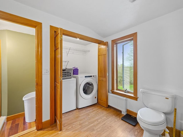 19 Falls Rd, Benton, ME 04901 - bathroom with radiator, washing machine and dryer, wood finished floors, toilet, and baseboards