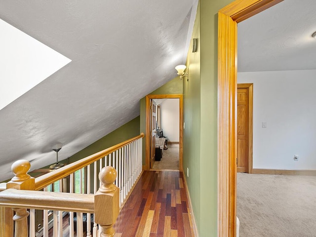 19 Falls Rd, Benton, ME 04901 - corridor featuring vaulted ceiling, wood finished floors, baseboards, and carpet flooring