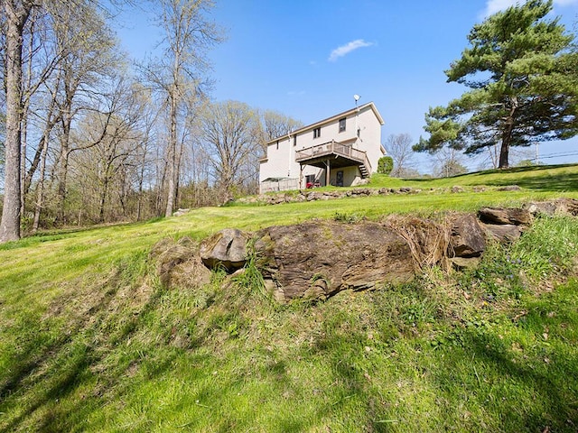 19 Falls Rd, Benton, ME 04901 - back of house featuring a deck and a lawn