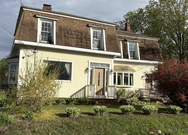 1233 State Route 32, Bristol, ME 04564 - view of front of home featuring a chimney, mansard roof, a front lawn, and roof with shingles