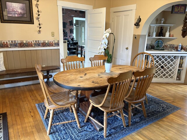 1233 State Route 32, Bristol, ME 04564 - dining space with hardwood / wood-style flooring, wainscoting, and arched walkways