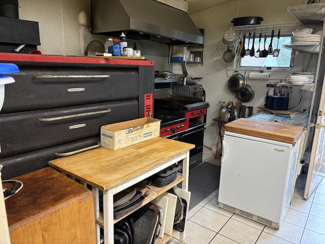 1233 State Route 32, Bristol, ME 04564 - kitchen with wall chimney exhaust hood, tile patterned floors, and fridge