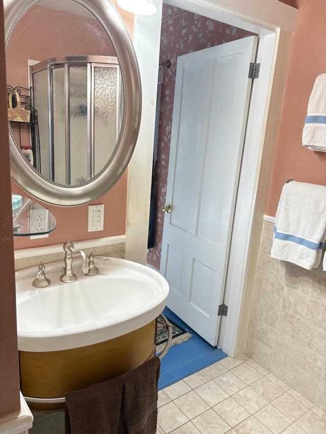 1233 State Route 32, Bristol, ME 04564 - bathroom featuring a wainscoted wall, tile patterned flooring, a stall shower, and wallpapered walls