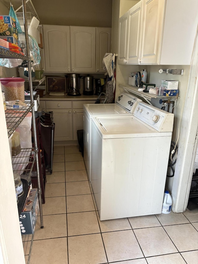 1233 State Route 32, Bristol, ME 04564 - laundry area with washer and dryer, light tile patterned floors, and cabinet space