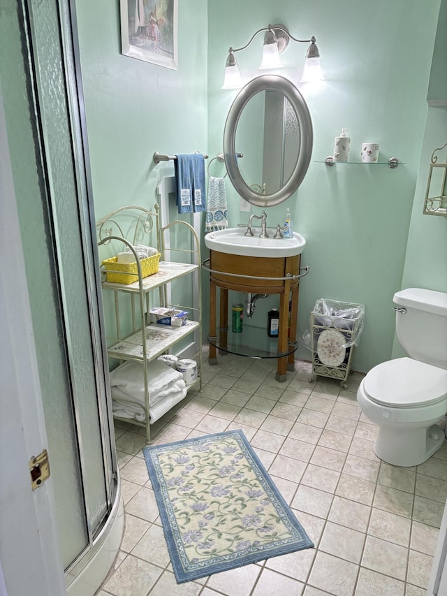 1233 State Route 32, Bristol, ME 04564 - bathroom featuring tile patterned floors, a stall shower, toilet, and a sink