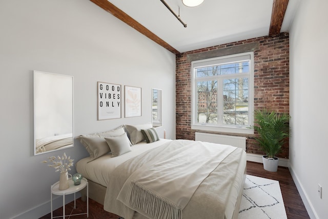 2 Main St Unit 35-203, Biddeford, ME 04005 - bedroom featuring radiator heating unit, brick wall, baseboards, and wood finished floors